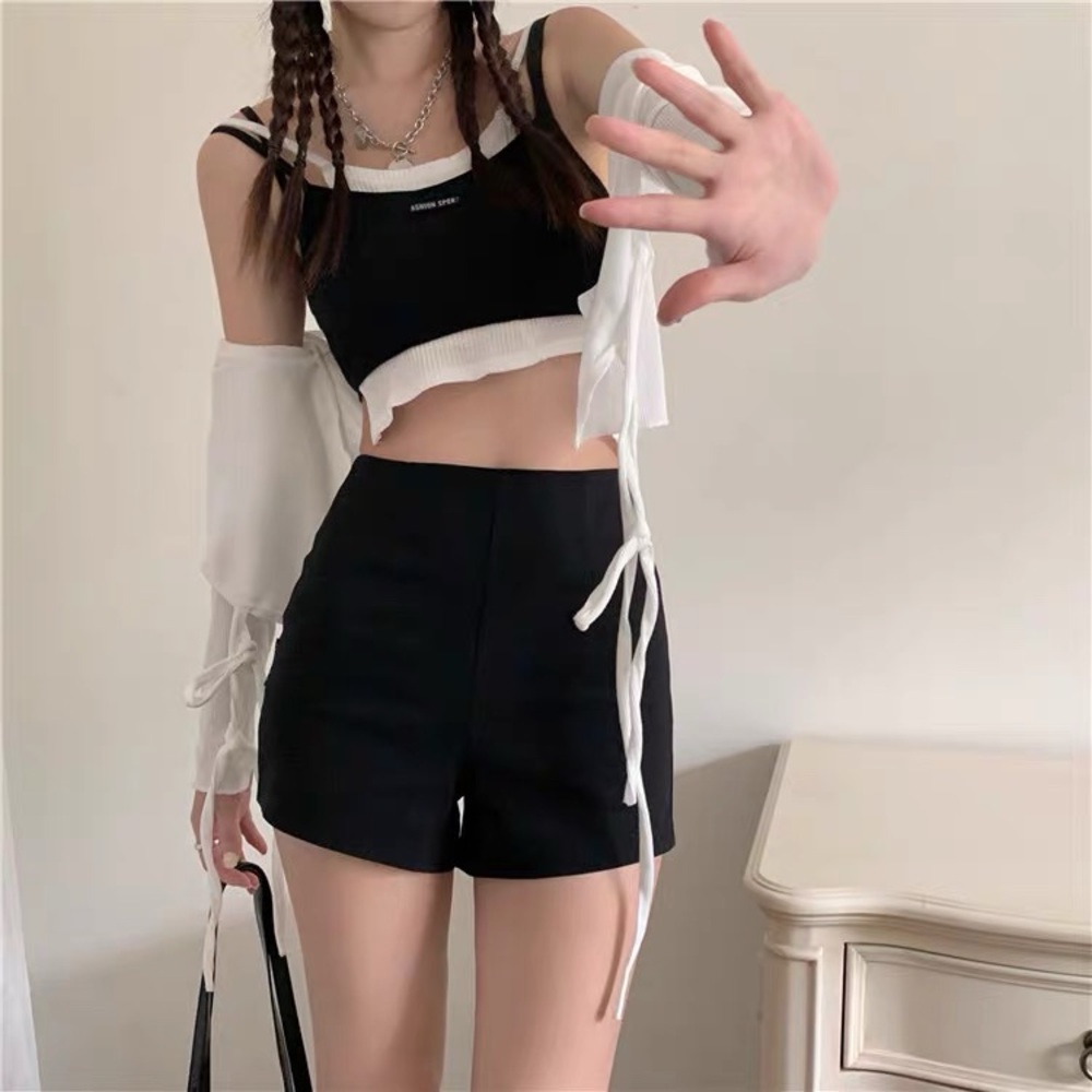 Chic black high-waisted preppy shorts with zipper detail